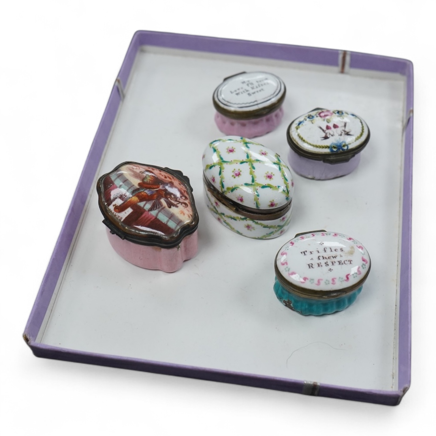 Five late 18th and 19th century enamel South Staffordshire patch boxes, largest 5.5cm wide